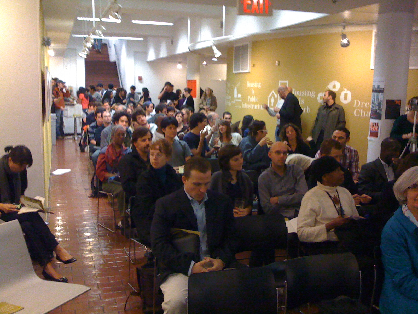 A group of people seated for a presentation
