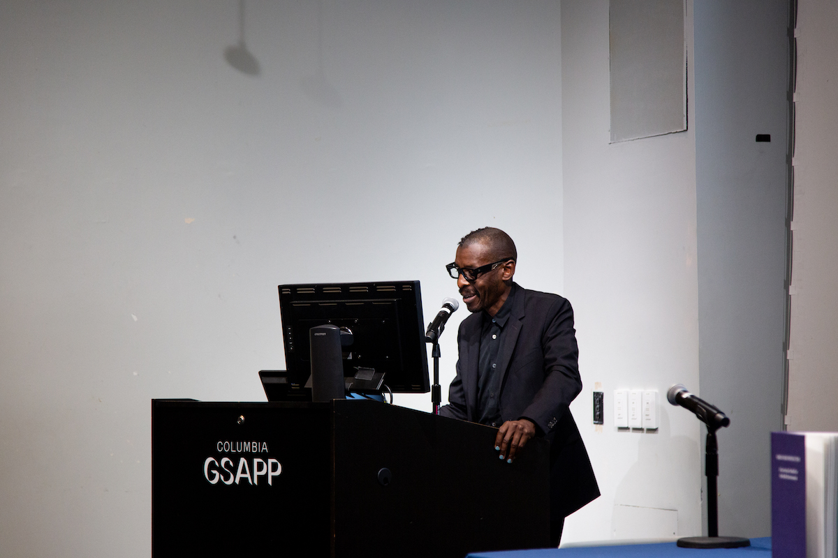 Mario Gooden presenting at the podium