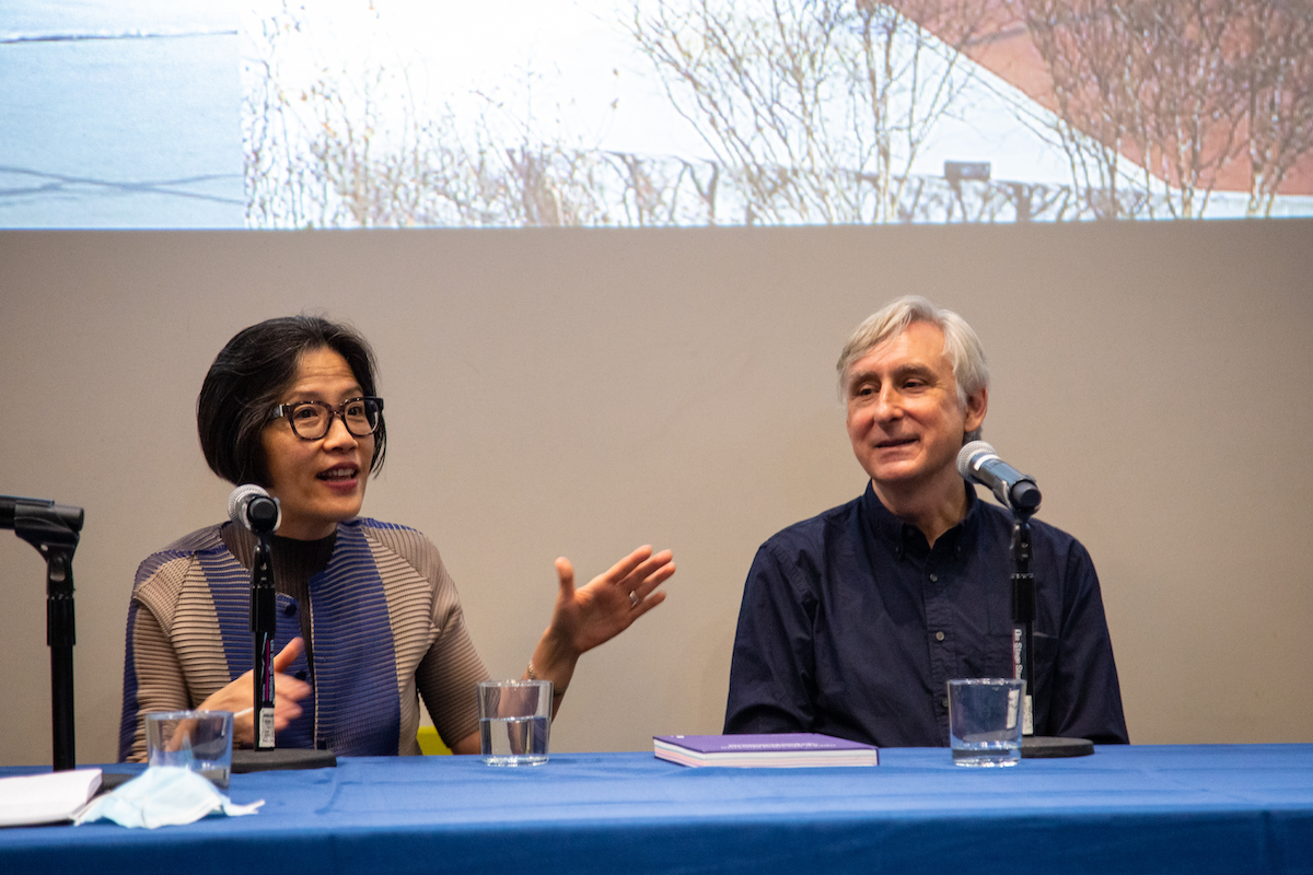 Weiping Wu sits next to Reinhold Martin and participates in the group discussion