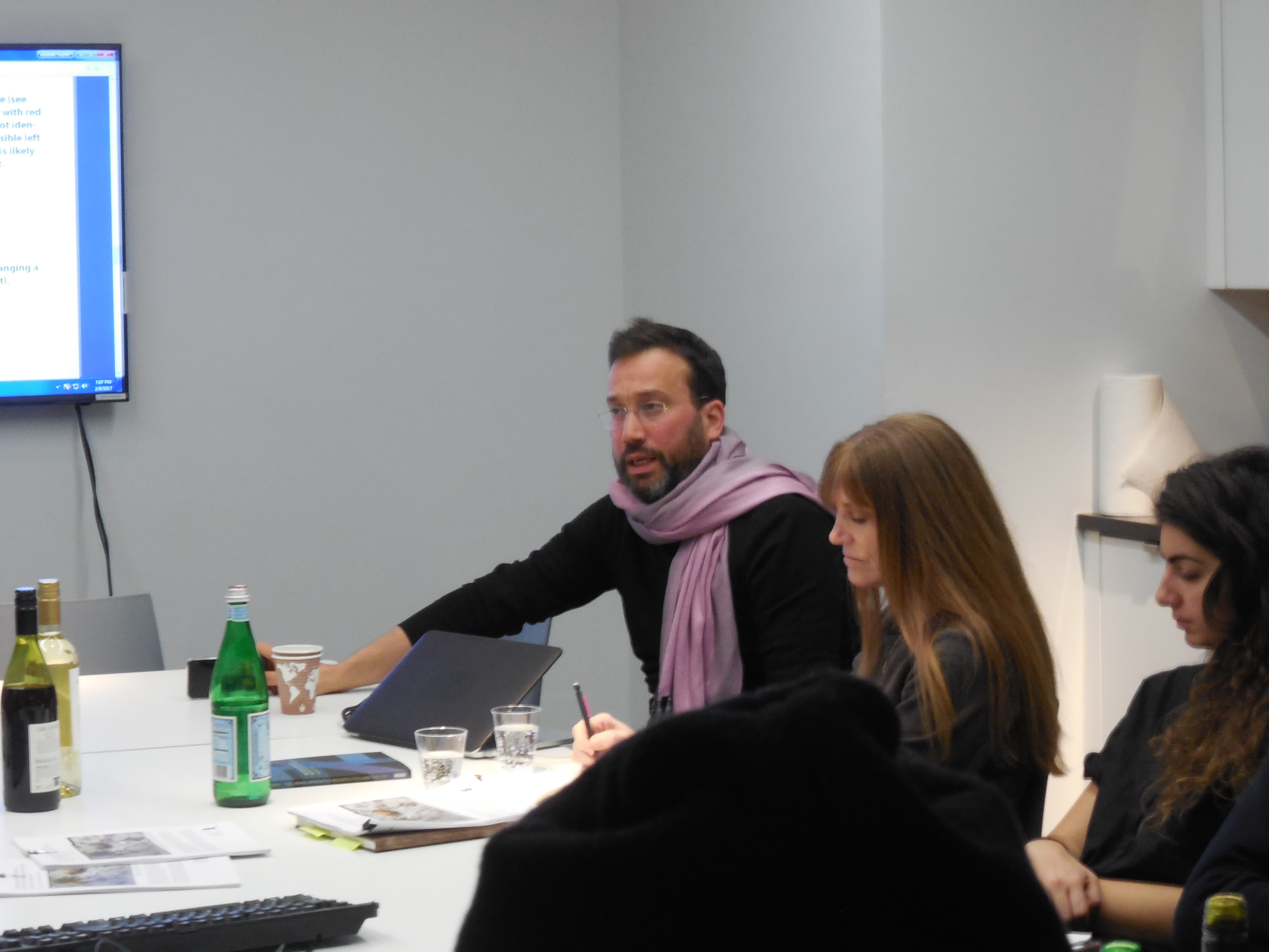 A man speaking passionately to a group of people.